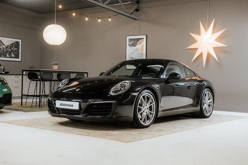 Svart Begagnad 2017 Porsche 911 Carrera Sportkupé | 995 000 kr - Bild 1/4