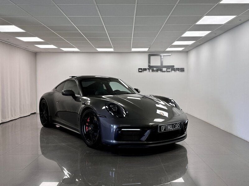 Mörkgrå (agate grey met.) Begagnad 2022 Porsche 911 Carrera 4 GTS Sportkupé | 1 639 900 kr (Marknadspris) - Bild 1/4