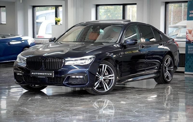Svart Begagnad 2016 BMW 750 M Sport Sedan | 379 900 kr (Superpris) - Bild 1/4