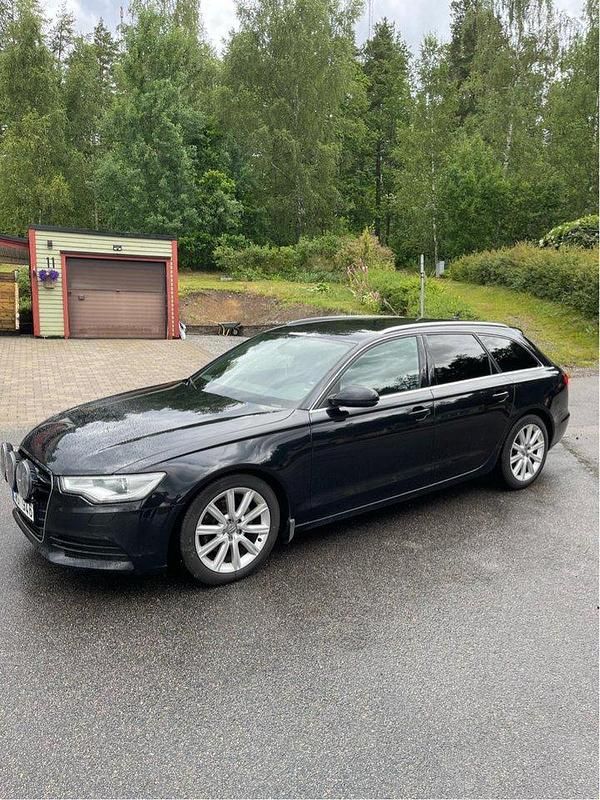 Svart Begagnad 2013 Audi A6 Ambition Kombi | 130 000 kr (Marknadspris) - Bild 1/4