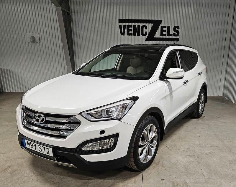 Vit (vit metallic (pearl)) Begagnad 2013 Hyundai Santa Fe Premium SUV | 119 000 kr (Marknadspris) - Bild 1/4