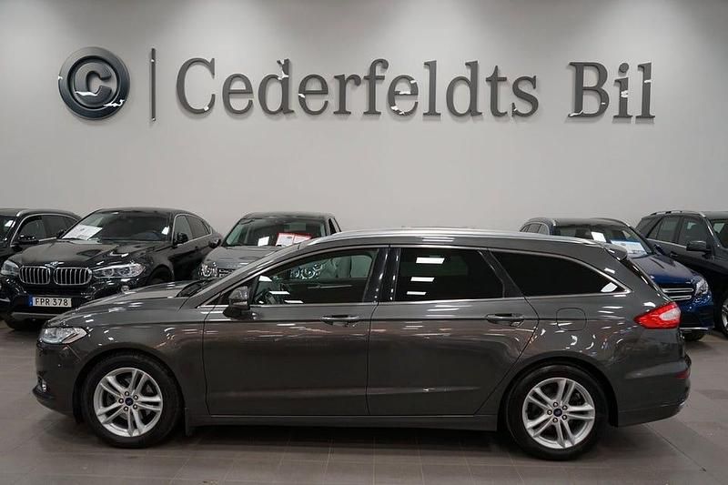Grå Begagnad 2015 Ford Mondeo Titanium Kombi | 139 900 kr (Marknadspris) - Bild 1/4