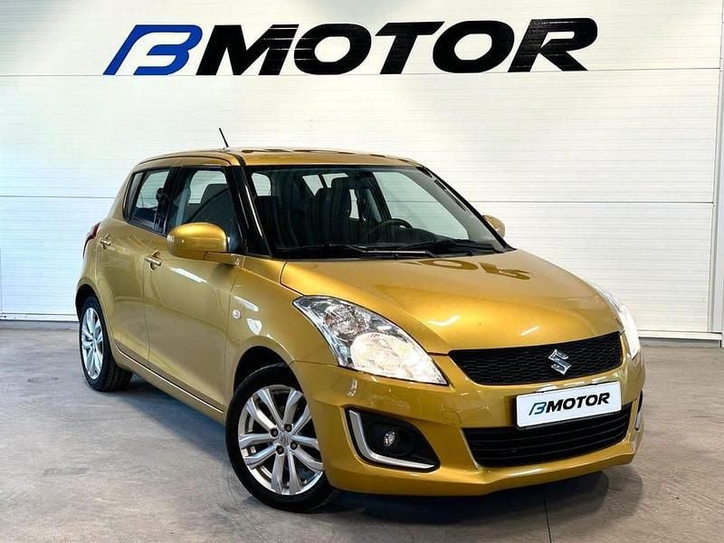 Gul Begagnad 2013 Suzuki Swift Halvkombi | 89 900 kr (Lite dyr) - Bild 1/4