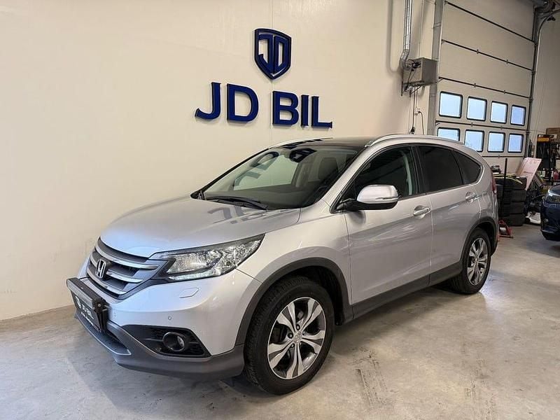 Silver Begagnad 2013 Honda CR-V Executive SUV | 129 900 kr (Marknadspris) - Bild 1/4
