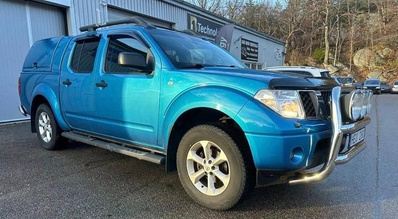Blå Begagnad 2006 Nissan Navara Pickup | 89 000 kr (Marknadspris) - Bild 1/4