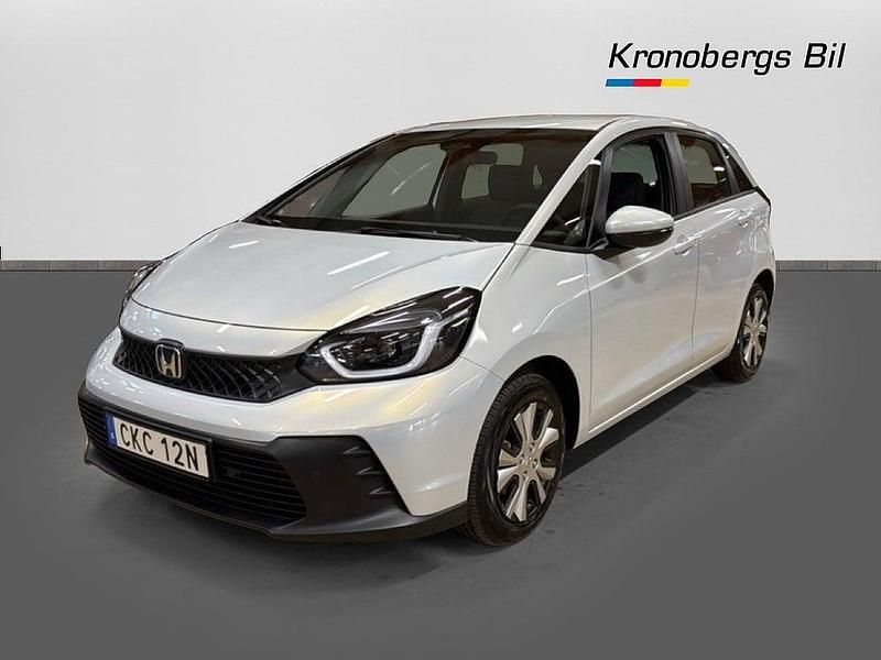 Premium sunlight white metallic Ny 2025 Honda Jazz Elegance Halvkombi | 288 800 kr (Marknadspris) - Bild 1/4