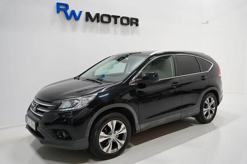 Svart Begagnad 2013 Honda CR-V Executive SUV | 104 800 kr (Marknadspris) - Bild 1/4