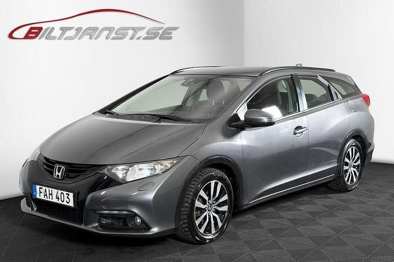 Grå Begagnad 2014 Honda Civic Kombi | 109 900 kr (Marknadspris) - Bild 1/4