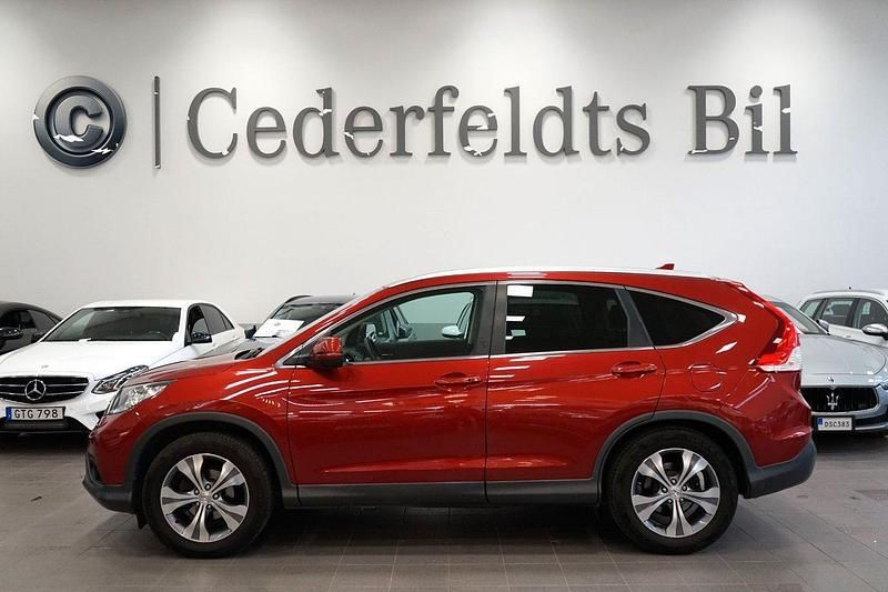 Röd Begagnad 2014 Honda CR-V Executive SUV | 169 800 kr (Marknadspris) - Bild 1/4