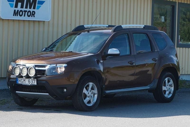 Brun Begagnad 2012 Dacia Duster SUV | 59 900 kr (Marknadspris) - Bild 1/4