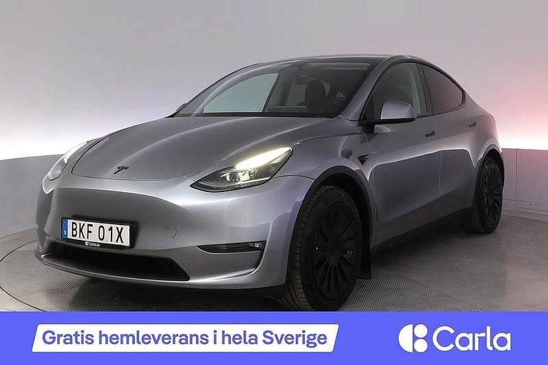 Grå Begagnad 2023 Tesla Model Y Long Range AWD SUV | 407 900 kr (Marknadspris) - Bild 1/4