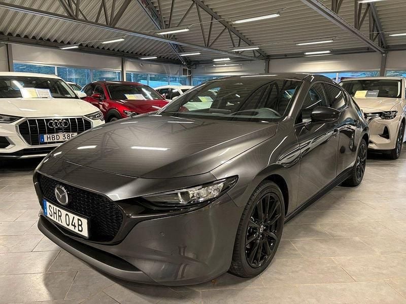 Machine grey metallic Ny 2024 Mazda 3 Nagisa Halvkombi | 349 500 kr - Bild 1/3