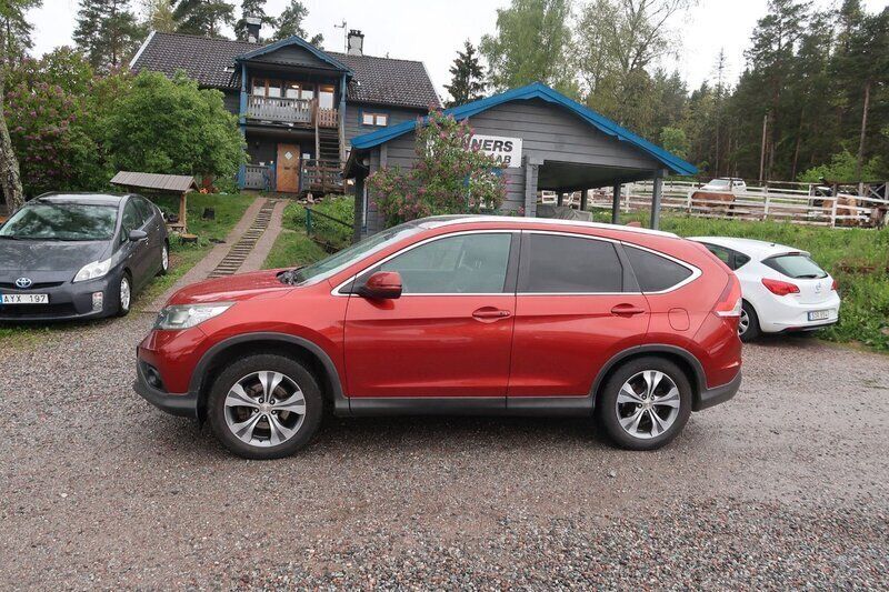 Röd Begagnad 2013 Honda CR-V Executive SUV | 141 500 kr (Marknadspris) - Bild 1/4
