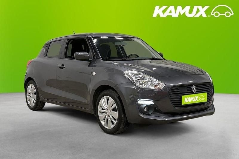 Silver/grå Begagnad 2019 Suzuki Swift GL Halvkombi | 113 900 kr (Marknadspris) - Bild 1/4
