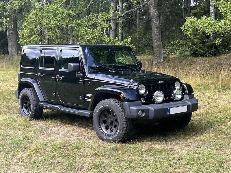 Svart Begagnad 2014 Jeep Wrangler Unlimited SUV | 299 000 kr (Marknadspris) - Bild 1/4