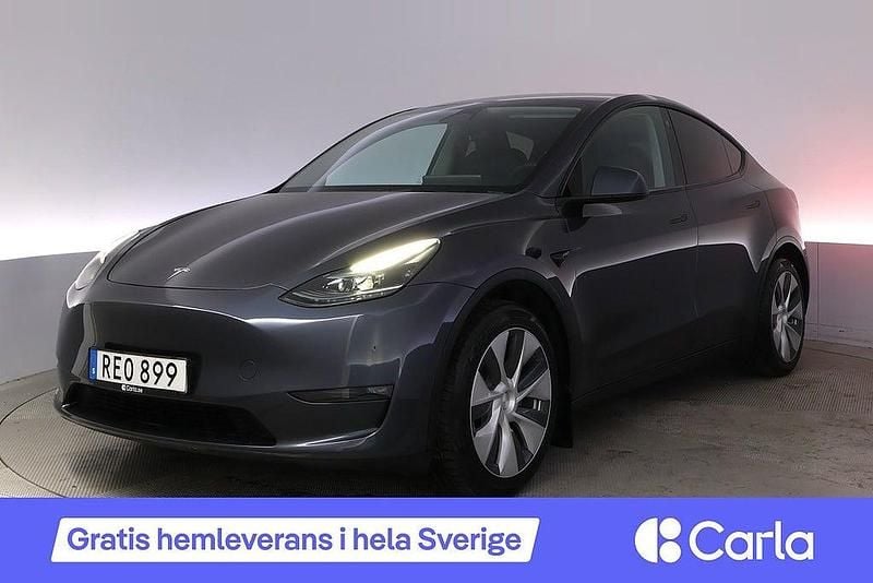 Grå Begagnad 2023 Tesla Model Y Long Range AWD SUV | 421 900 kr (Marknadspris) - Bild 1/4