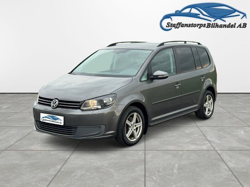 Mörkgrå Begagnad 2011 VW Touran Minibuss | 59 900 kr (Dyr) - Bild 1/4