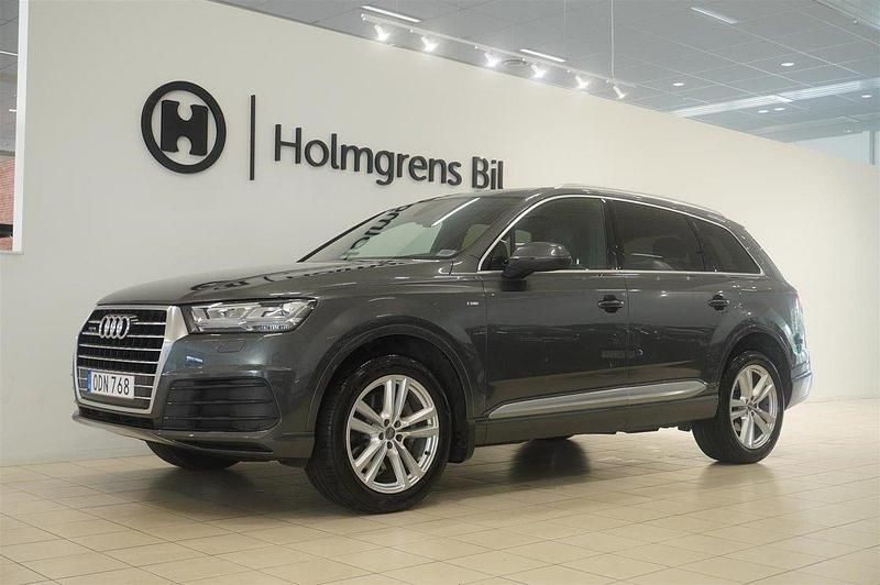 Grå Begagnad 2016 Audi Q7 S-Line SUV | 399 900 kr (Marknadspris) - Bild 1/4