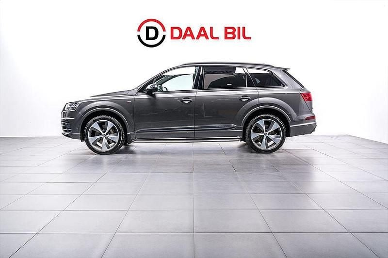 Grå Begagnad 2018 Audi Q7 Comfort SUV | 419 700 kr (Marknadspris) - Bild 1/4