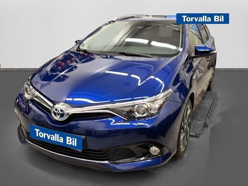 Blå Begagnad 2016 Toyota Auris Hybrid Kombi | 179 900 kr (Marknadspris) - Bild 1/4