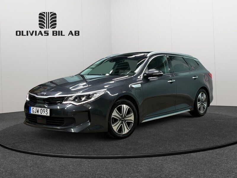 Grå Begagnad 2018 Kia Optima Hybrid Sport Sedan | 179 400 kr (Marknadspris) - Bild 1/4