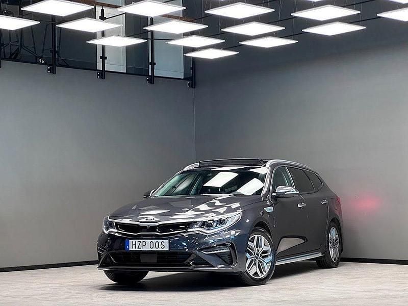 Grå Begagnad 2019 Kia Optima Hybrid 2 Sedan | 269 900 kr (Lite dyr) - Bild 1/4