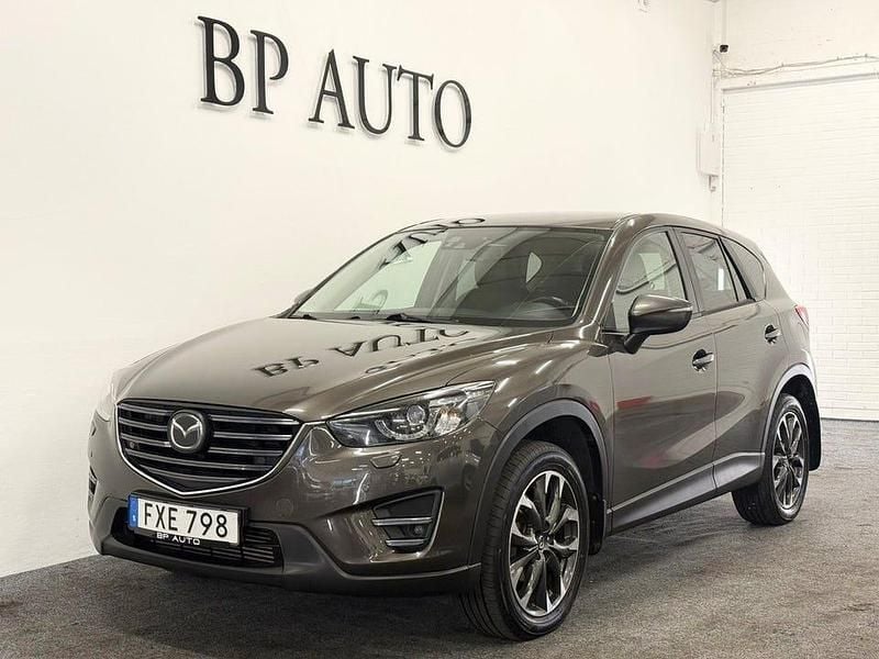 Brun Begagnad 2015 Mazda CX-5 SUV | 144 900 kr (Marknadspris) - Bild 1/4