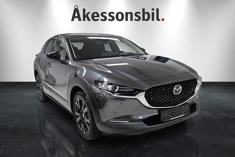 Machine grey Ny 2025 Mazda CX-30 Homura-Line SUV | 349 000 kr (Marknadspris) - Bild 1/4