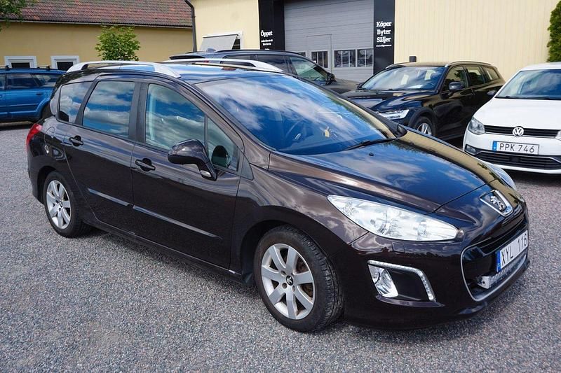 Mörkbrun Begagnad 2012 Peugeot 308 Kombi | 49 900 kr (Marknadspris) - Bild 1/4