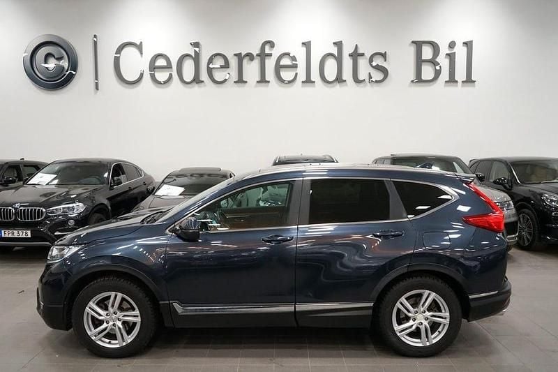 Mörkblå Begagnad 2018 Honda CR-V Executive SUV | 239 900 kr (Marknadspris) - Bild 1/4