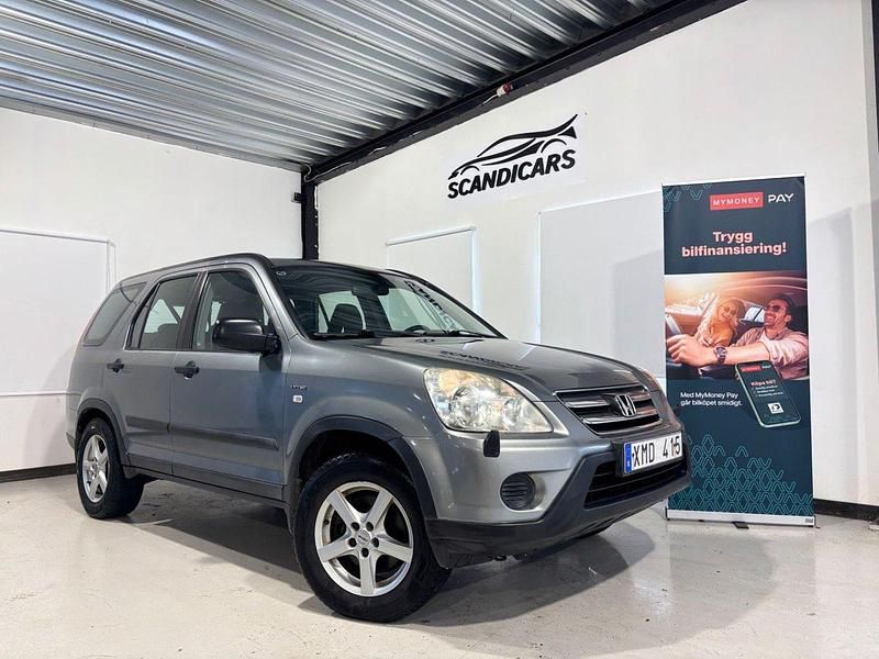 Grå Begagnad 2005 Honda CR-V SUV | 59 900 kr (Marknadspris) - Bild 1/4