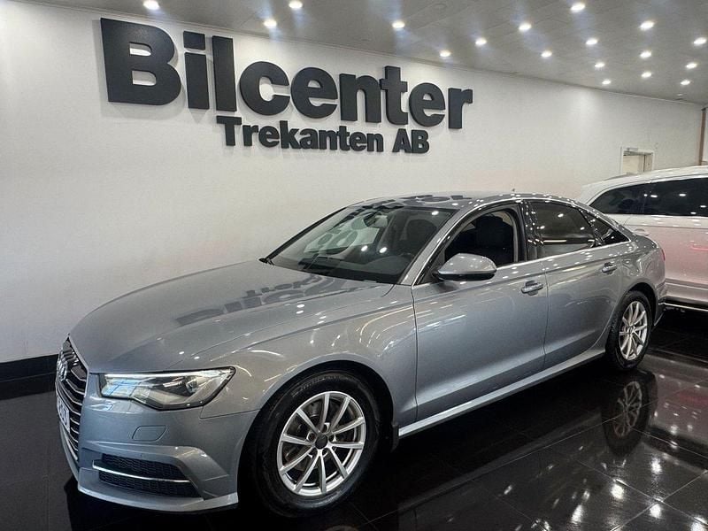 Grå Begagnad 2015 Audi A6 Sport Sedan | 199 900 kr (Marknadspris) - Bild 1/4