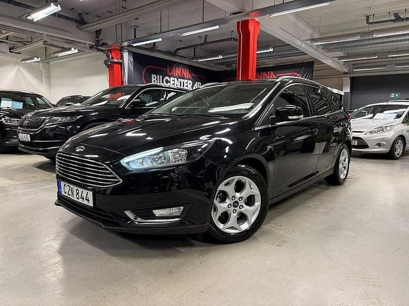 Svart metallic Begagnad 2014 Ford Focus Titanium Kombi | 69 900 kr (Marknadspris) - Bild 1/4