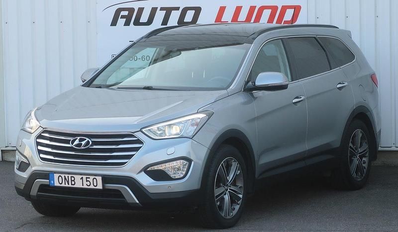 Silver (silvermetallic) Begagnad 2014 Hyundai Grand Santa Fe Premium SUV | 159 900 kr - Bild 1/4