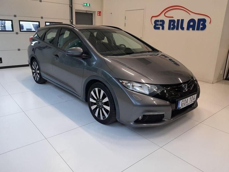 Mörkgrå (grå) Begagnad 2014 Honda Civic Kombi | 99 900 kr (Marknadspris) - Bild 1/4