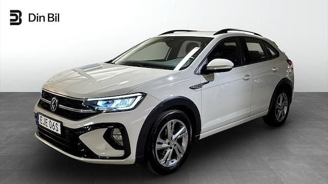 Grå (ascot grey) Begagnad 2022 VW Taigo R-line SUV | 244 900 kr (Marknadspris) - Bild 1/4