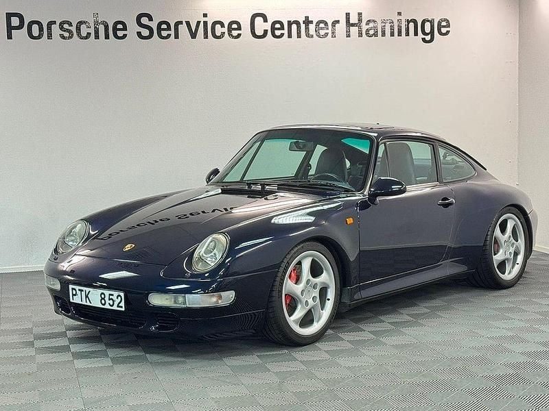 Mörkblå Begagnad 1996 Porsche 911 Carrera 4S | 1 595 000 kr - Bild 1/4
