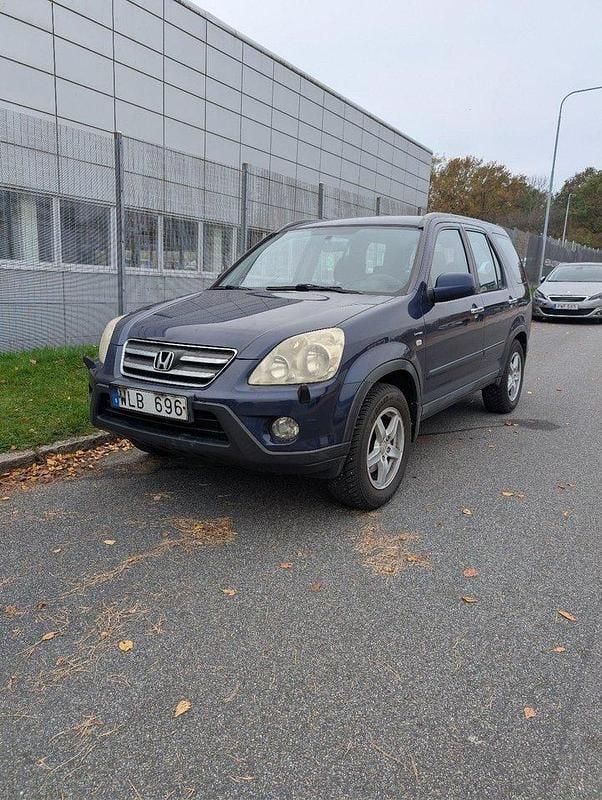 Blå Begagnad 2005 Honda CR-V SUV | 35 000 kr (Marknadspris) - Bild 1/4