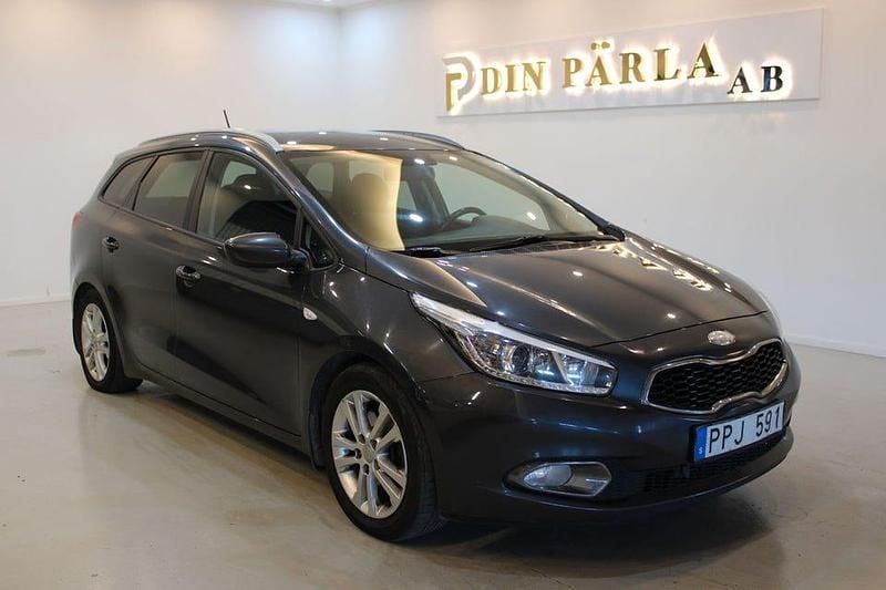 Grå Begagnad 2014 Kia Ceed Sportswagon EX Kombi | 49 900 kr (Marknadspris) - Bild 1/4