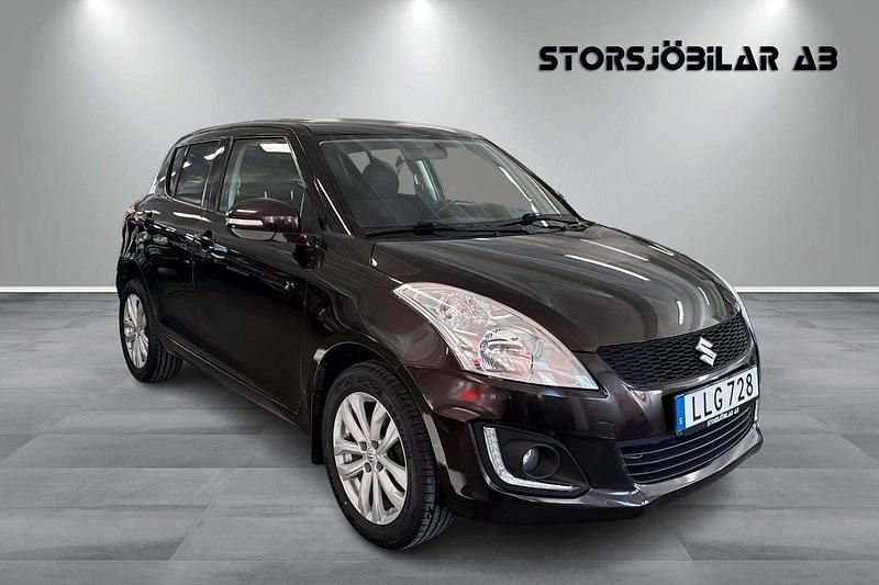 Brun Begagnad 2014 Suzuki Swift Halvkombi | 99 000 kr (Dyr) - Bild 1/4