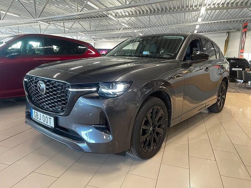 Machine grey metallic Begagnad 2023 Mazda CX-60 Homura-Line SUV | 419 000 kr (Bra pris) - Bild 1/4