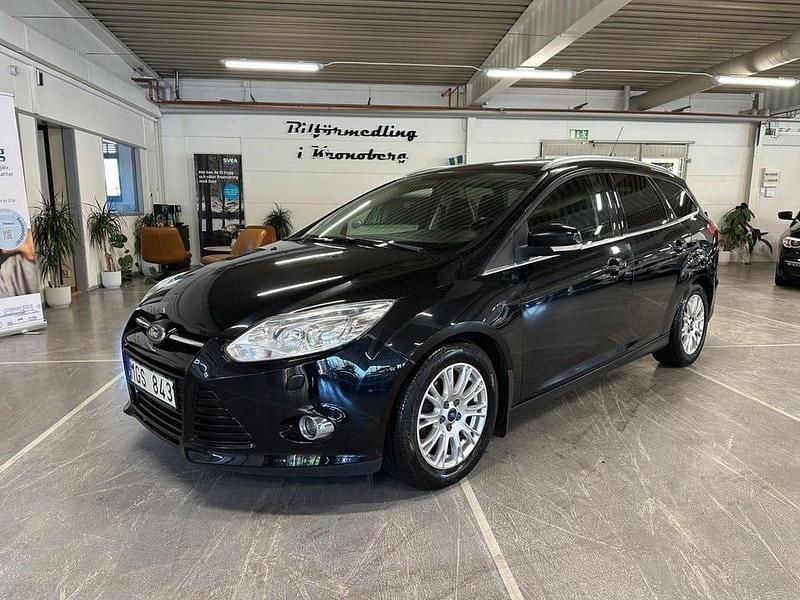 Svart Begagnad 2011 Ford Focus Titanium Kombi | 49 900 kr (Marknadspris) - Bild 1/4