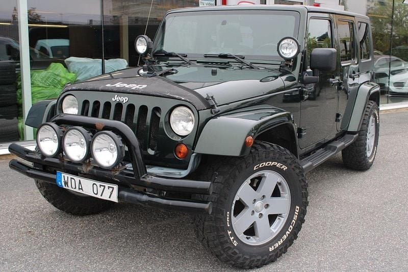 Mörkgrön (grön) Begagnad 2010 Jeep Wrangler Unlimited SUV | 209 900 kr (Bra pris) - Bild 1/4