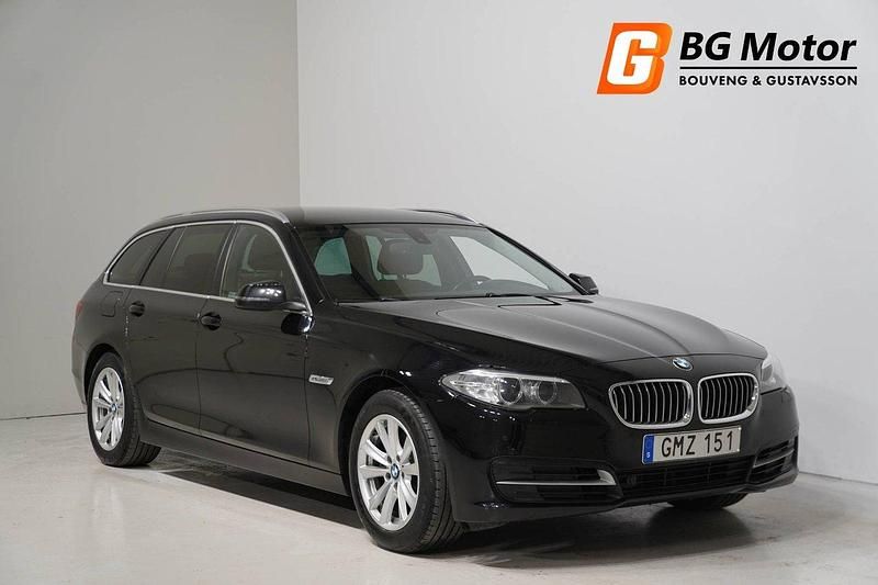 Svart Begagnad 2014 BMW 520 Kombi | 139 800 kr (Marknadspris) - Bild 1/4