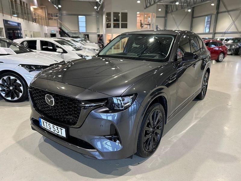 Grå Begagnad 2022 Mazda CX-60 Homura-Line SUV | 389 900 kr (Marknadspris) - Bild 1/4