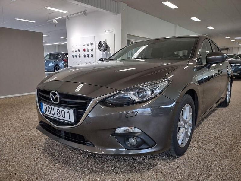 Brun Begagnad 2014 Mazda 3 Vision Halvkombi | 119 900 kr (Marknadspris) - Bild 1/4