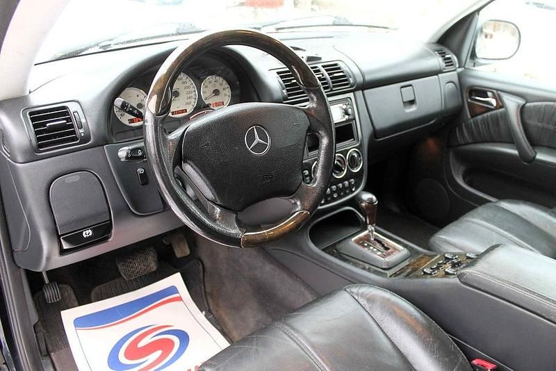 Begagnad Mercedes ML55 AMG AMG 347 HK (255 kW) 2000 Svart SUV