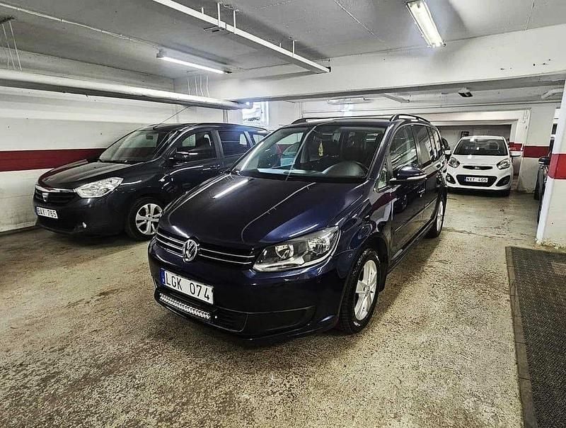 Mörkblå Begagnad 2011 VW Touran Minibuss | 84 900 kr (Dyr) - Bild 1/4