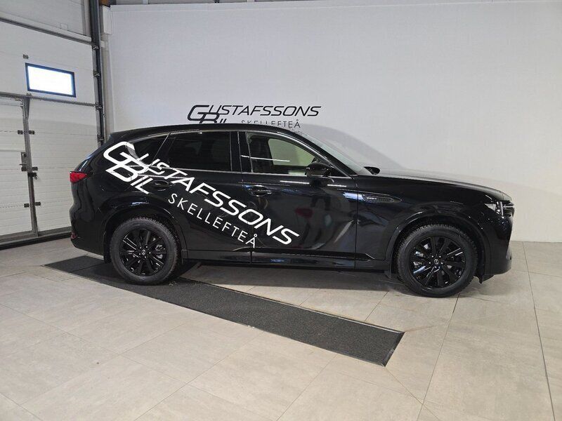 Jet black mica Begagnad 2022 Mazda CX-60 Homura-Line SUV | 524 500 kr (Marknadspris) - Bild 1/4
