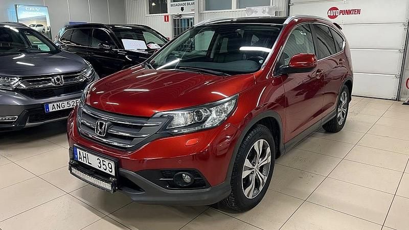 Passion red Begagnad 2014 Honda CR-V Executive SUV | 169 900 kr (Marknadspris) - Bild 1/4